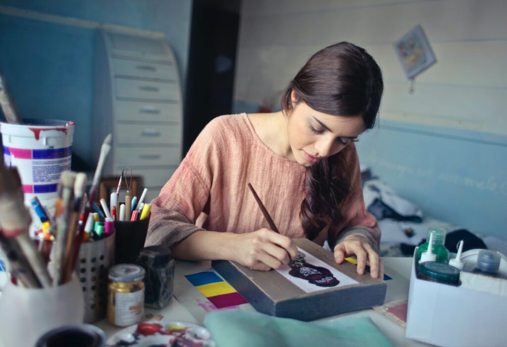 creative woman drawing and painting