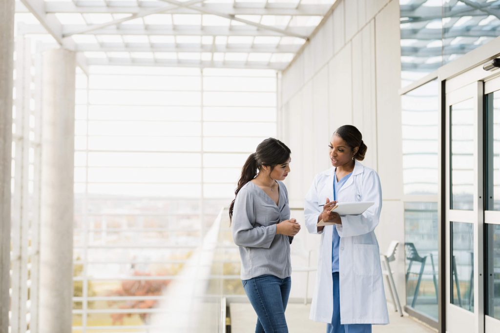 medical doctor explaining to her patient the lab tests